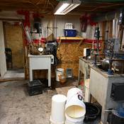 A clandestine synthetic drug lab was found in a hidden room underneath the garage.
