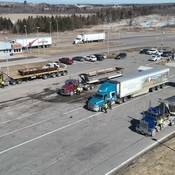 Multiple trucks stopped with police at drivers windows