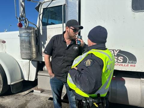 Truck driver giving breath sample