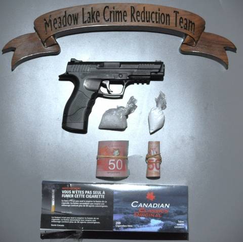 Photo of seized items, including 27 grams of methamphetamine, 15 grams of cocaine, an imitation firearm, $675 in cash, and unstamped tobacco.