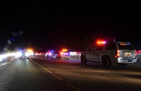 BC Highway Patrol cruisers at night working an enforcement check stop