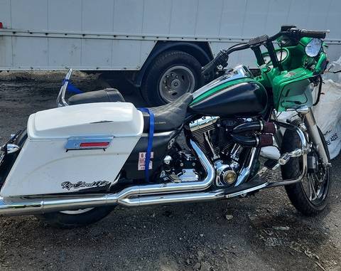 This black motorcycle with green fairing and white hard luggage was involved in a fatal collision where police are looking for a key witness
