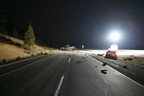A photo taken Friday night with a crashed Hyundai Kona and a grey Dodge Ram pickup on its side
