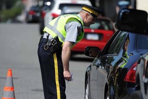 Officer talking to driver through car window