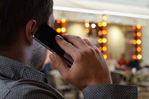Man holding phone to ear