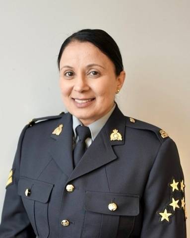 Cpl. Dhesi wearing a blue Serge uniform.
